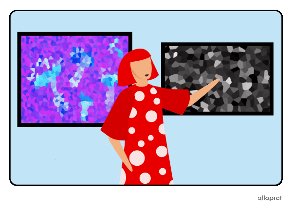 A person pointing to a painting with brighter colours than the one next to it.