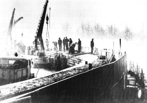 A photo of the construction of the Berlin Wall.