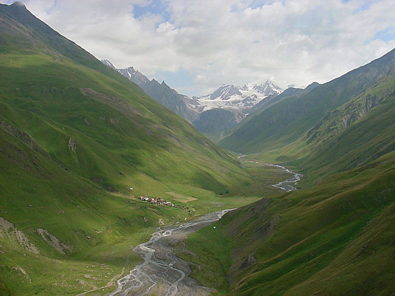 A river winds through a Caucasus valley