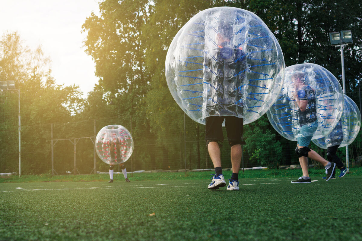 Bubble soccer players.