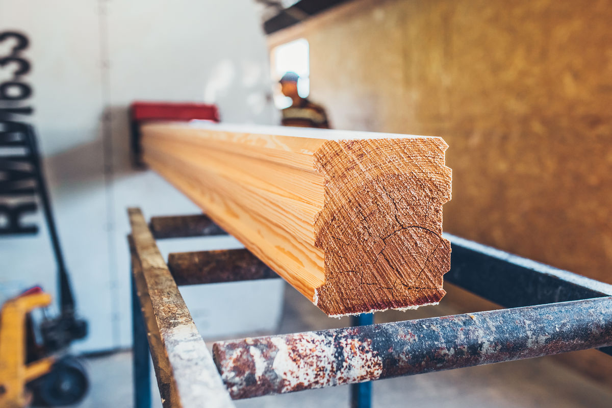 Shaping a wooden beam.