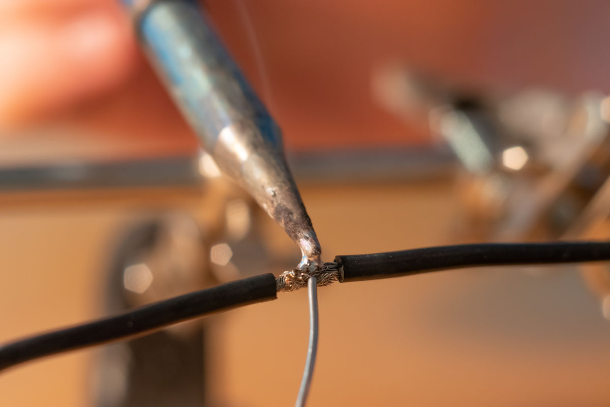 Soldering two conductive wires.