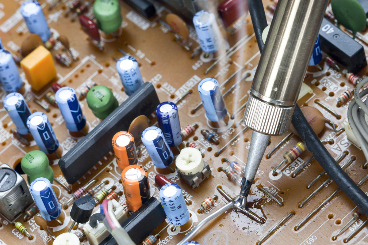  Soldering a printed circuit.