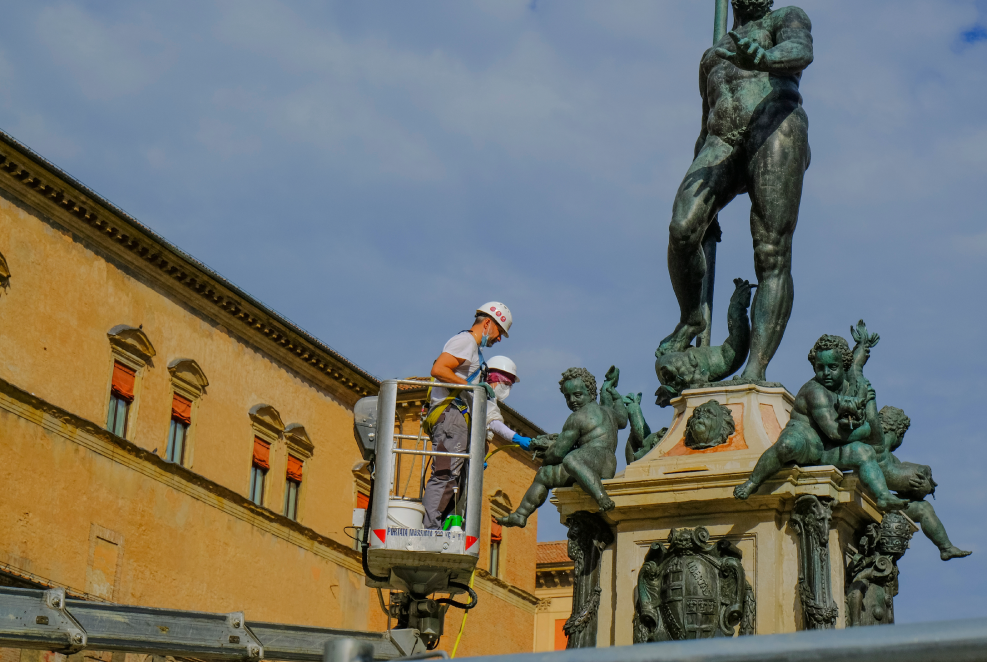 Photograph of Workers Cleaning a Monument.