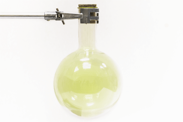 Chlorine gas in a round-bottom flask.