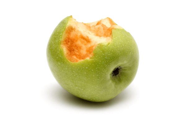 A photograph of a green apple with browned pulp.