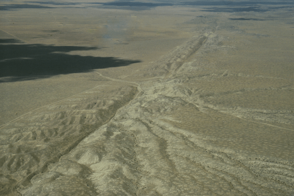 A photograph of the San Andreas fault seen from above in a desert in California, USA. 