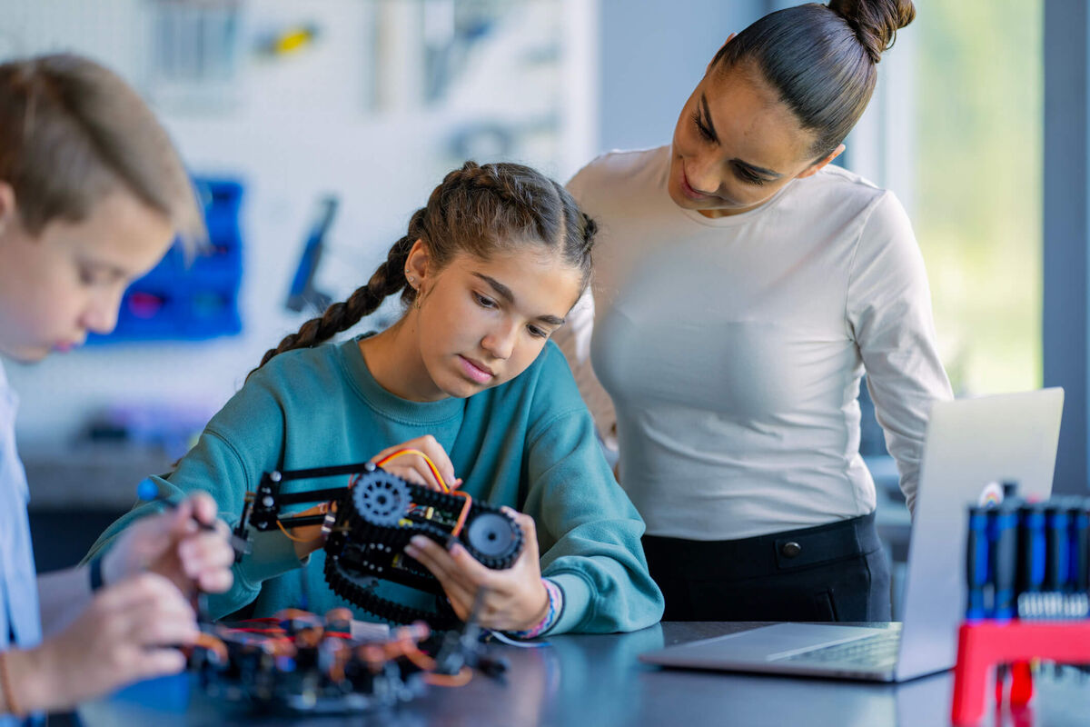 A student making a robot in class.