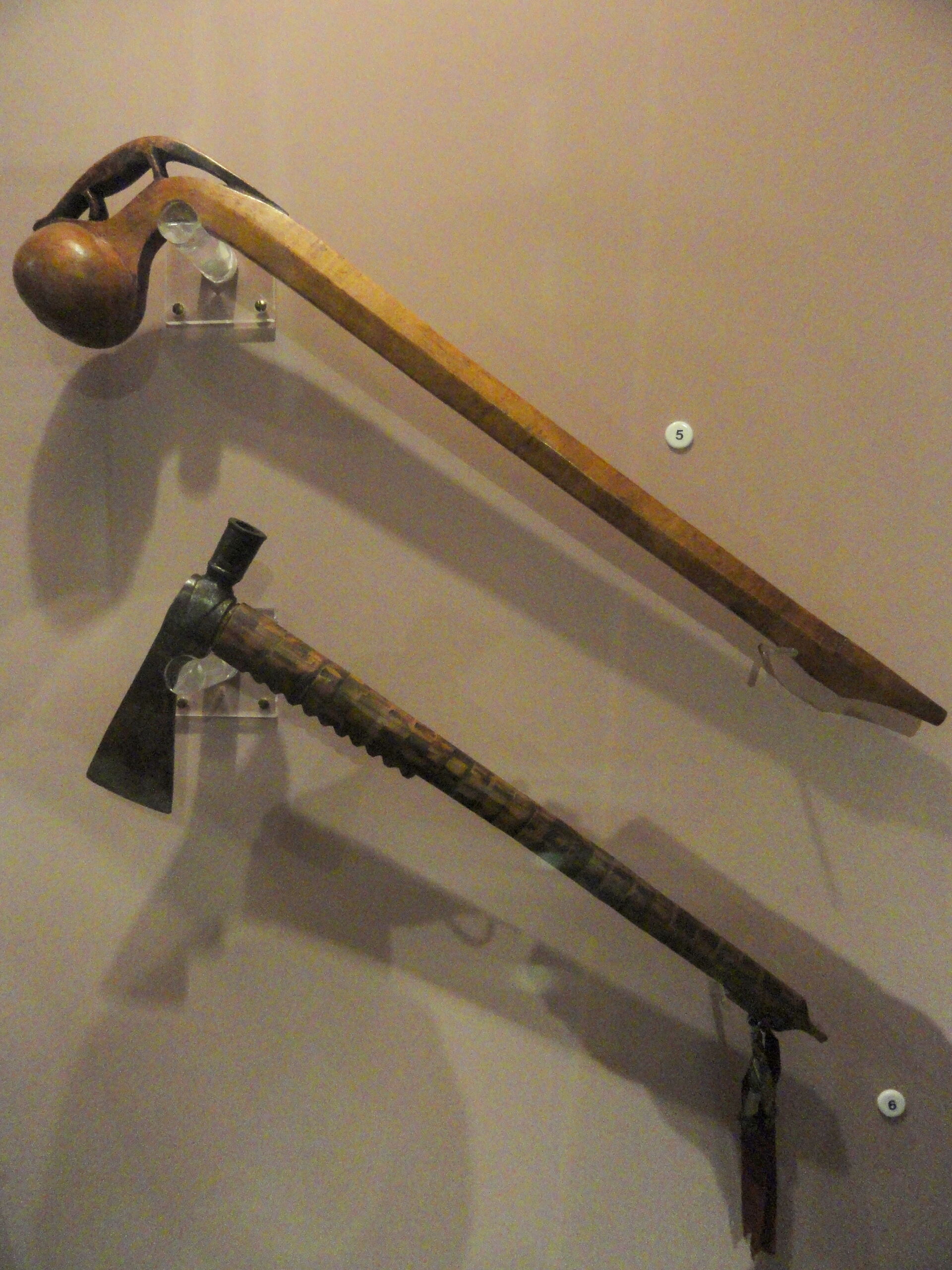 A Club Displayed Above a Tomahawk.
