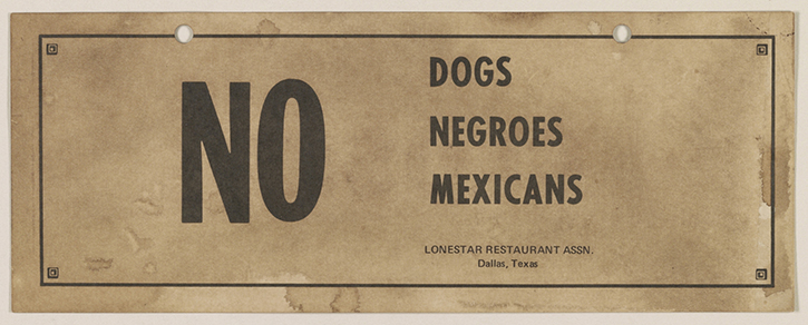 Sign enforcing racial discrimination.