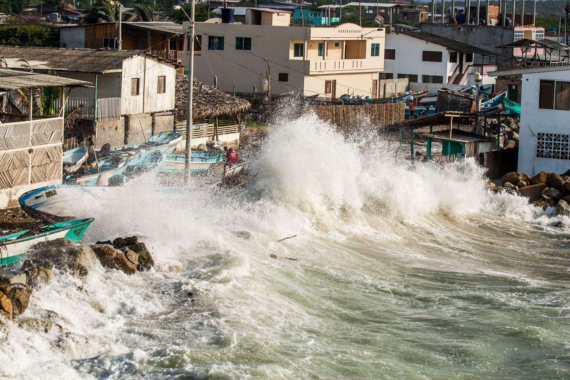 Waves and tides flooding part of a coastal town, San Jacinto, Ecuador.