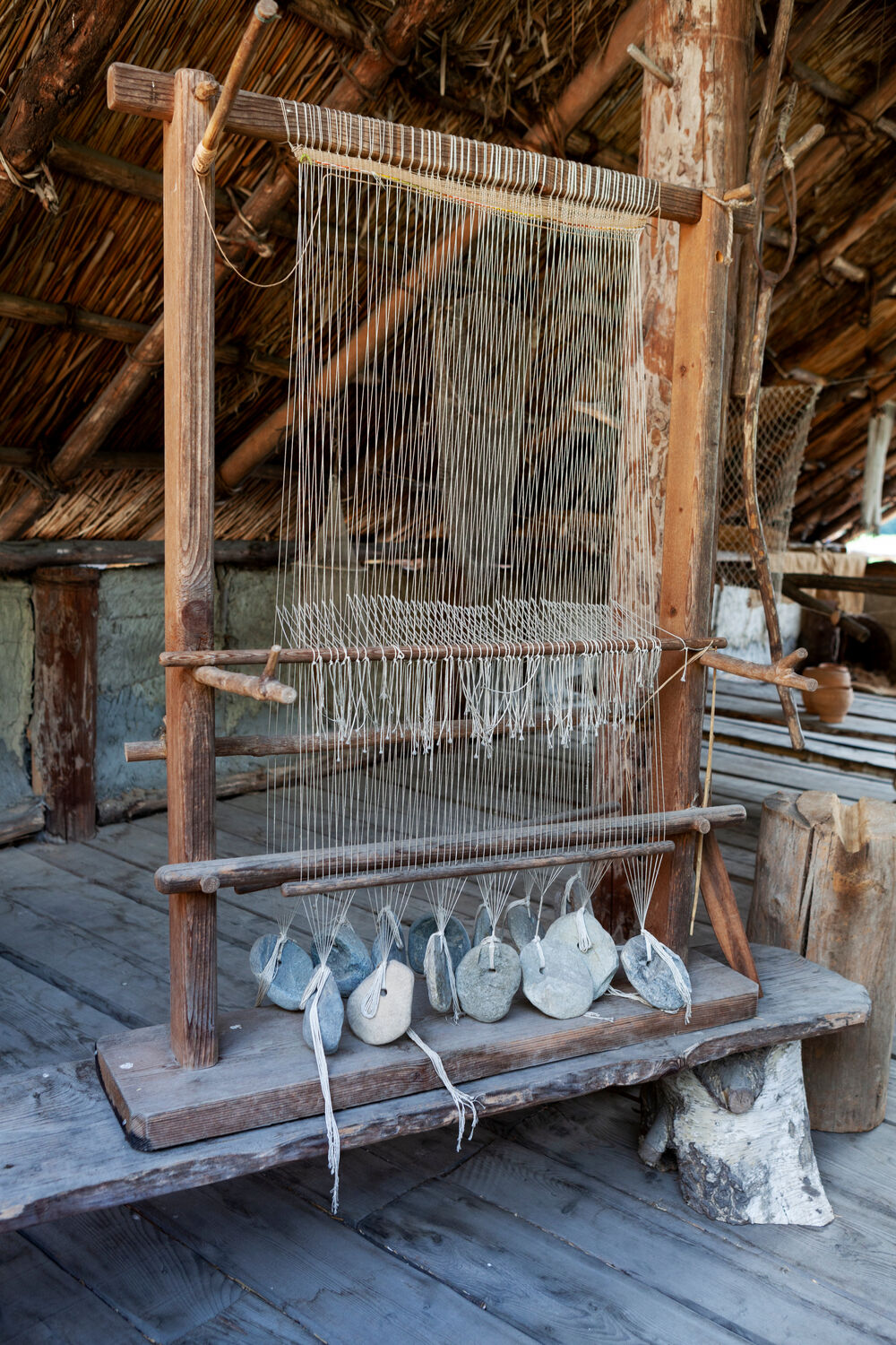 A weaving loom (a device used to make cloth).