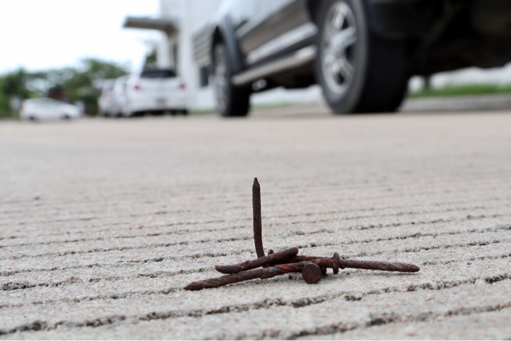 Nail on the road.