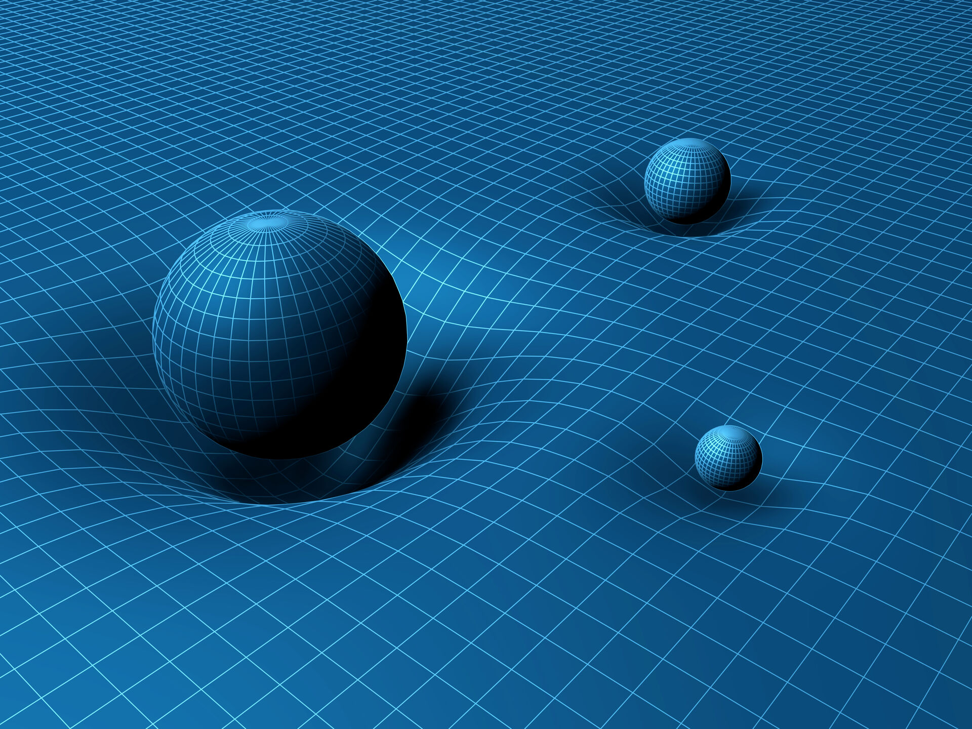 Three balls of different masses sink into a gridded surface representing the space-time deformation.