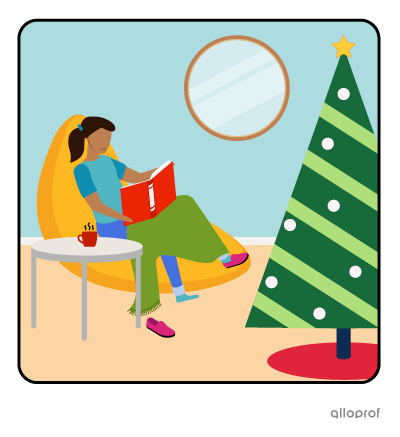 Sarah is reading a book next to the christmas tree. She’s very comfy.