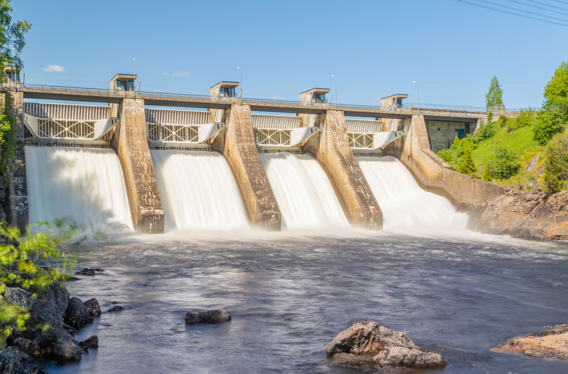 Water flows through the gates of a hydroelectric dam