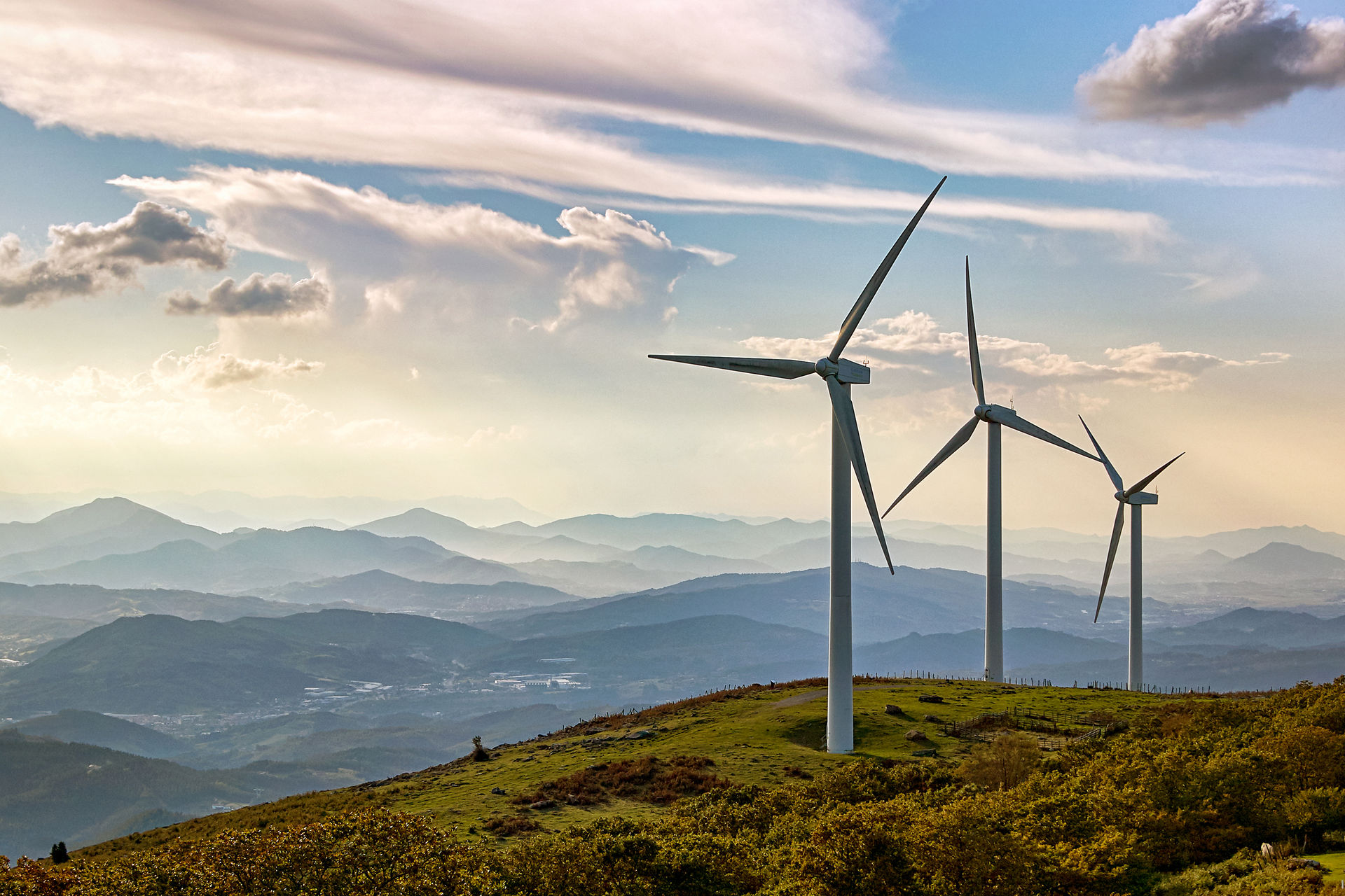 Three wind turbines on a hill