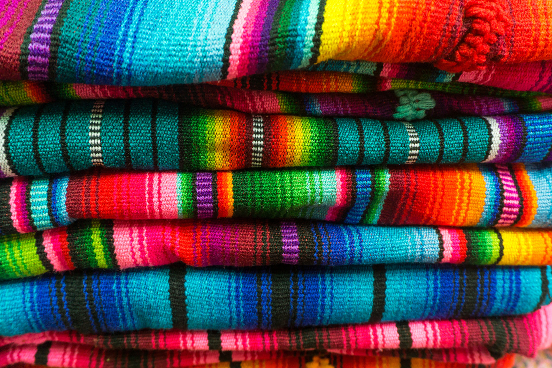 A pile of fabric of various colours.