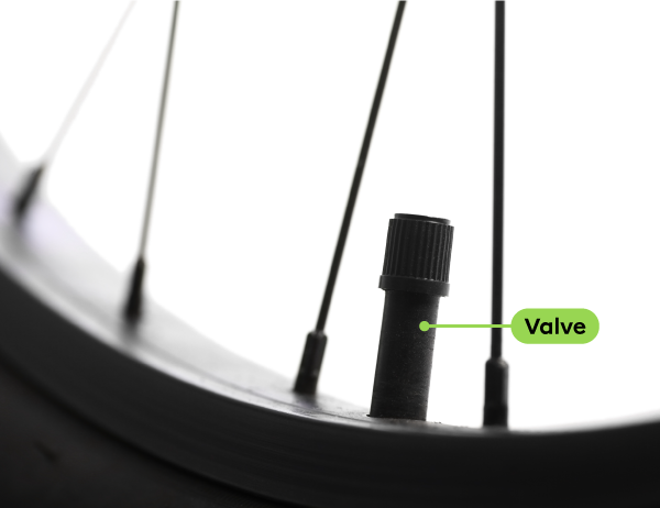 By preventing air from escaping from a bicycle tire, the valve serves a sealing function.