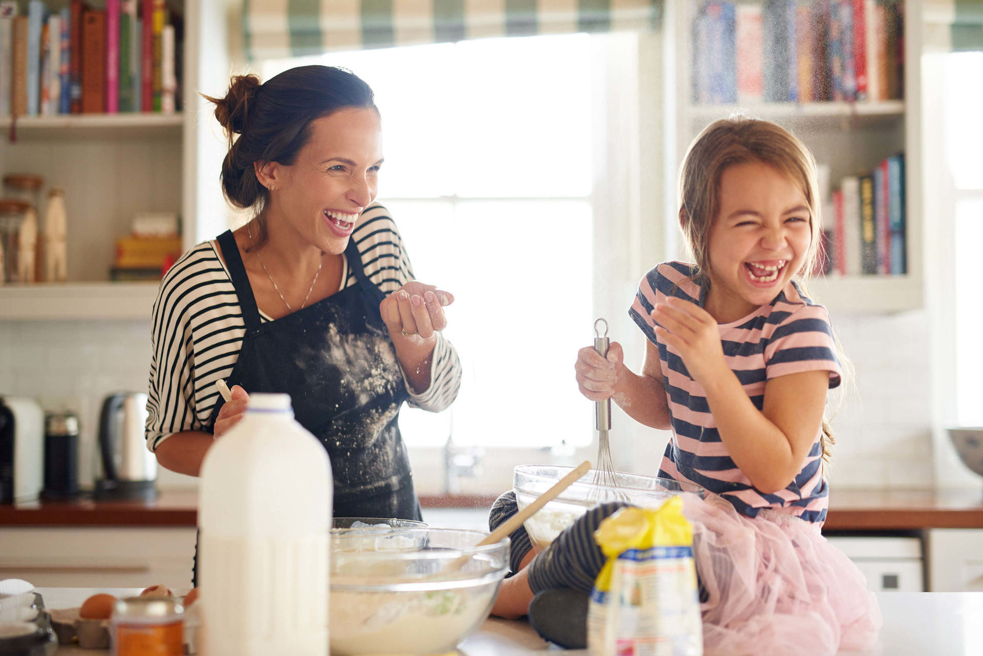 Parent and child making cookies.