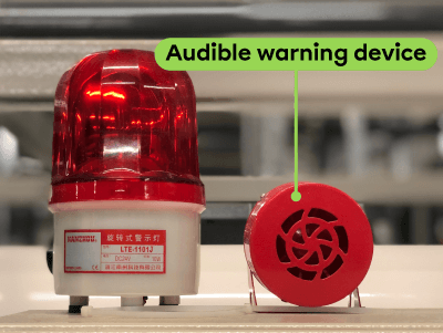 An audible warning device, or an alarm.