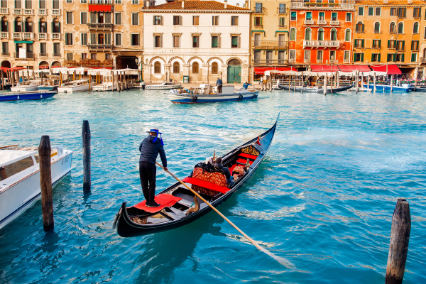 A gondola sails through the canals of Venice.