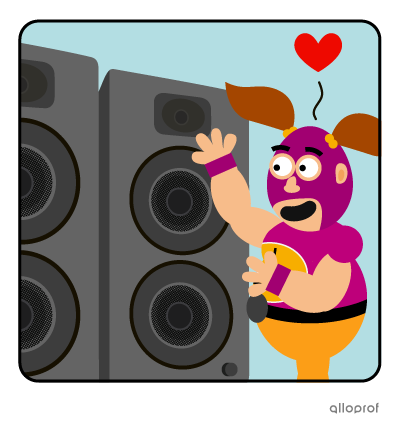 A wrestler in a mask looking at his new giant speakers.