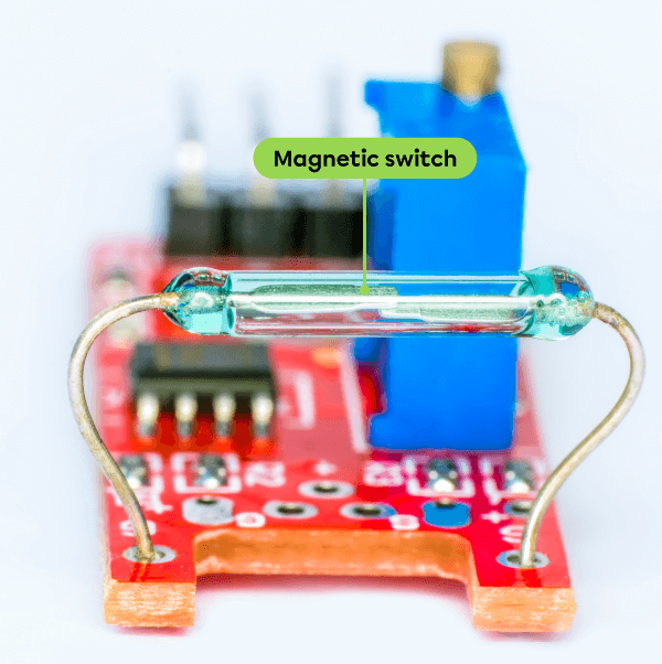 A magnetic switch in an electronic circuit.