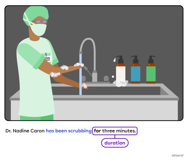 Woman scrubbing her hands before a surgical intervention.