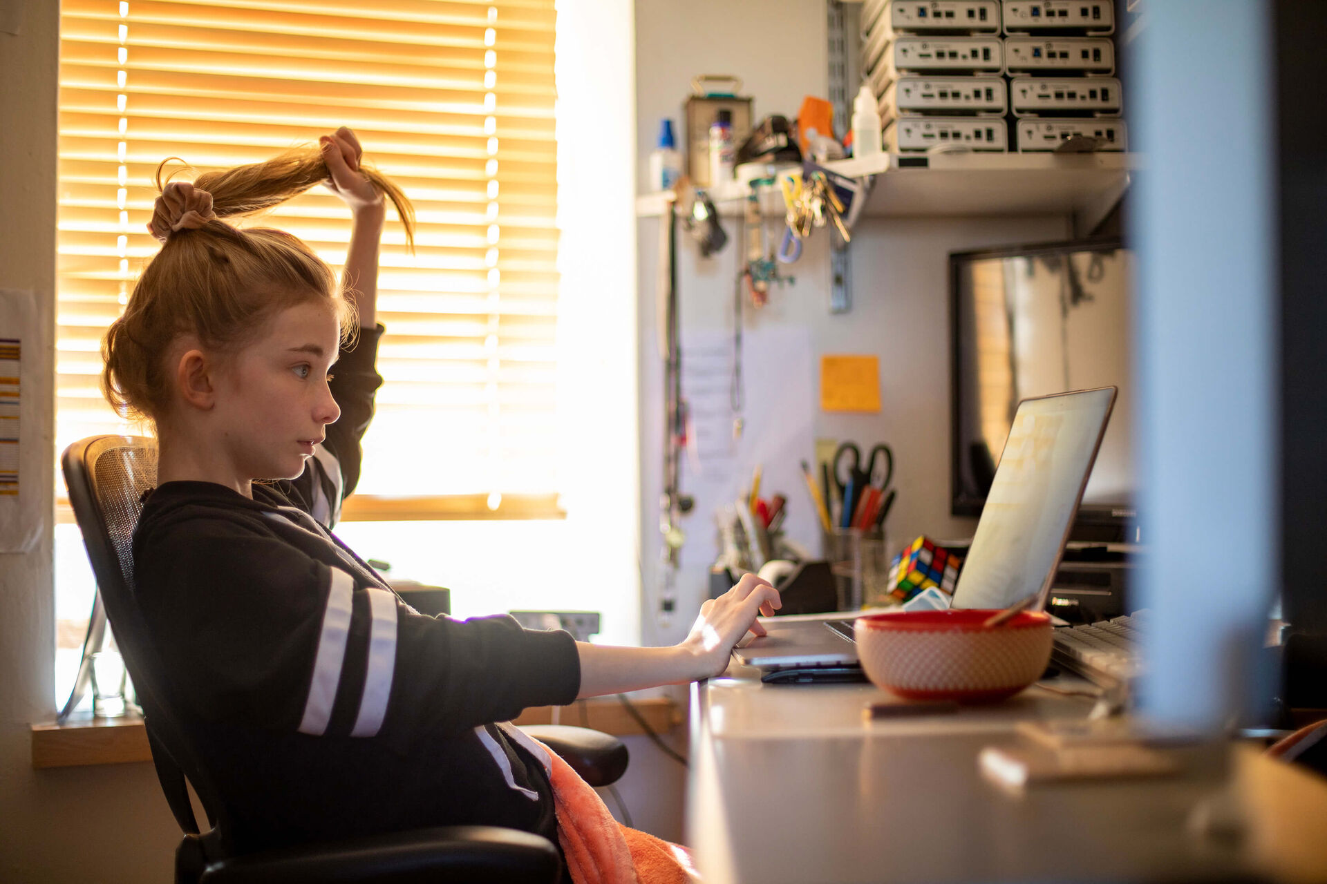A girl fidgeting with her hair